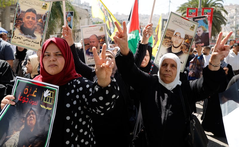 Palestinians flash the victory sign as they gather to support efforts of the Western countries that are recognising a Palestinian state at the United Nations General Assembly (UNGA).
