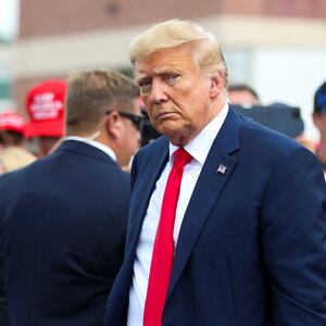 Former President Donald Trump leaves the opening of his campaign headquaters in Manchester, New Hampshire.