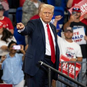 Donald Trump points to the crowd during a campaign rally at the Georgia State University Convocation Center in Atlanta, Georgia,