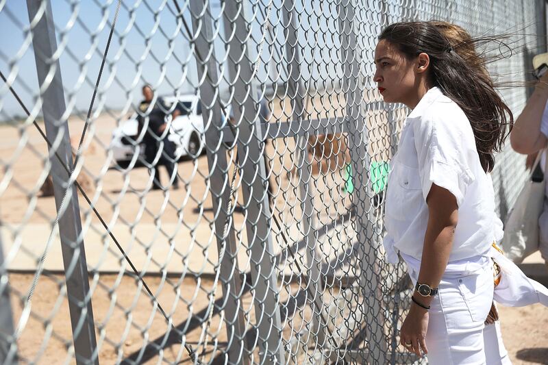 A photograph of Alexandria Ocasio-Cortez at the U.S. border entry gate on June 24, 2018 in Tornillo, Texas as a protest against the government’s immigration policy of separating children from their parents.