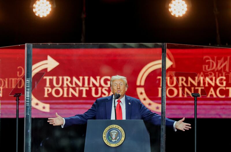 U.S. President Donald Trump speaks onstage during a memorial service for slain conservative commentator Charlie Kirk at State Farm Stadium, in Glendale, Arizona, U.S., September 21, 2025.  REUTERS/Daniel Cole