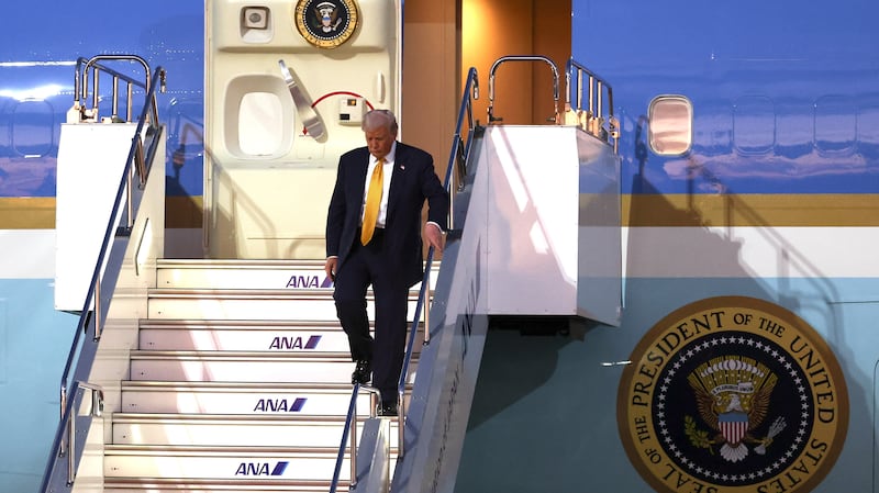 U.S. President Donald Trump disembarks Air Force One as he arrives at Haneda Airport on October 27, 2025 in Tokyo, Japan.