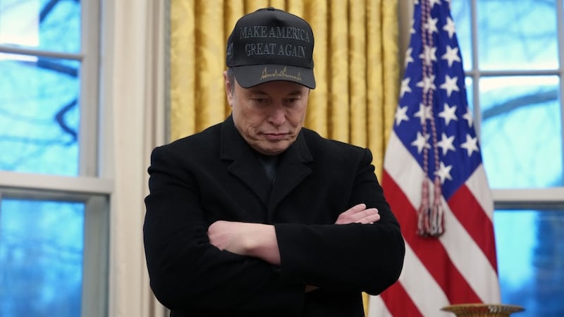 Elon Musk joins President Donald Trump during an executive order signing in the Oval Office.
