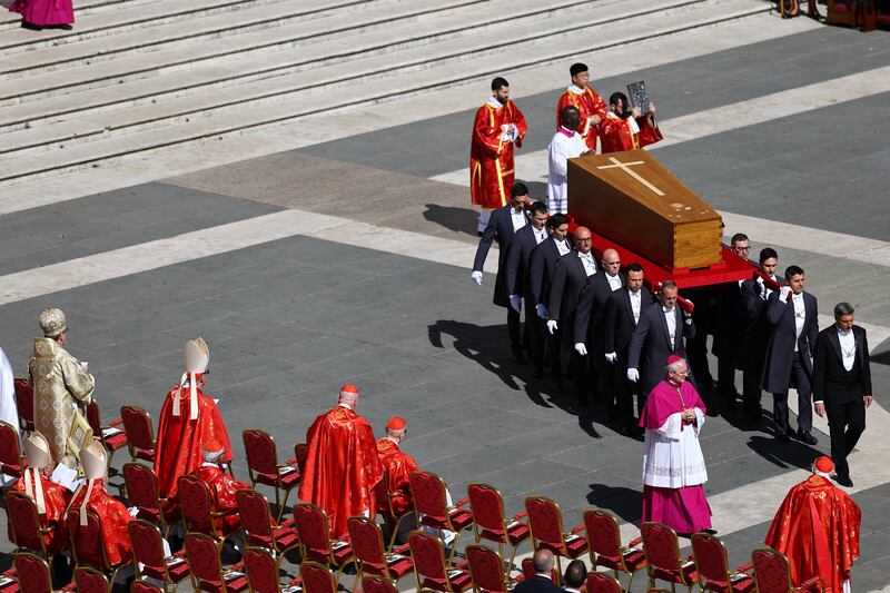 The coffin of Pope Francis is carried during the funeral Mass of Pope Francis in St. Peter's Square at the Vatican, April 26, 2025.