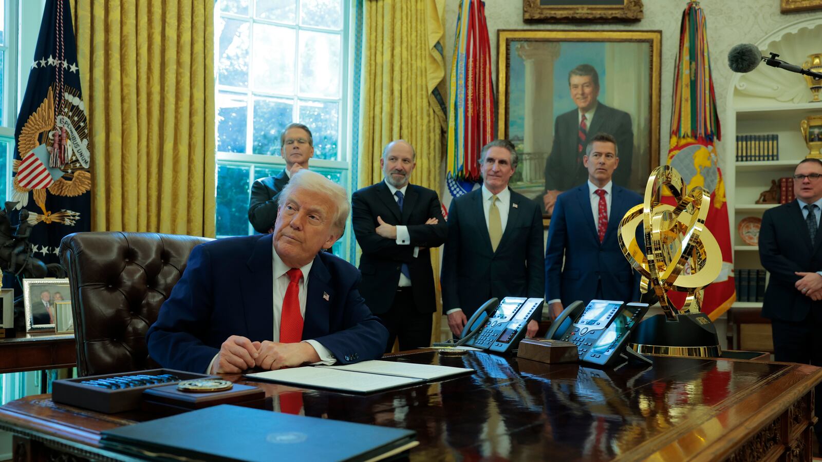 WASHINGTON, DC - APRIL 09: U.S. President Donald Trump signs an executive order as (L-R) U.S. Treasury Secretary Scott Bessent, Secretary of Commerce Howard Lutnick and Interior Secretary Doug Burgum look on in the Oval Office of the White House on April 09, 2025 in Washington, DC. President Trump signed several executive orders including directing the “repeal of unlawful regulations” and reducing “anti-competitive regulatory barriers.” Earlier today, Trump announced a 90-day pause on the full effect of his new tariffs for dozens of countries with the exception of China. (Photo by Anna Moneymaker/Getty Images)