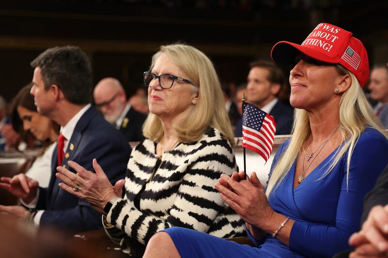 (L-R) Rep. John McGuire (R-VA), Rep. Carol Miller (R-WV), and Rep. Marjorie Taylor Greene (R-GA) attend U.S. President Donald Trump's address to a joint session of Congress at the U.S. Capitol on March 04, 2025 in Washington, DC.