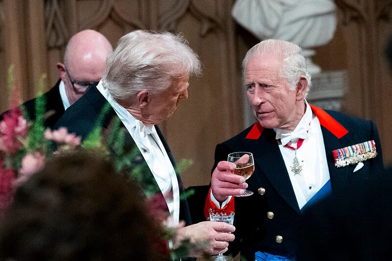 U.S. President Donald Trump speaks with King Charles III as they attend the State Banquet hosted by King Charles III and members of the Royal Family at Windsor Castle during the state visit by the President of the United States of America on September 17, 2025 in Windsor, England. President Trump is in England from Sept. 16-18 on his second UK state visit, with the previous one taking place in 2019 during his first presidential term. (Photo by Doug Mills-Pool/Getty Images)