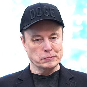 Elon Musk listens as U.S. President Donald Trump speaks to reporters in the Oval Office of the White House on May 30, 2025 in Washington, D.C.