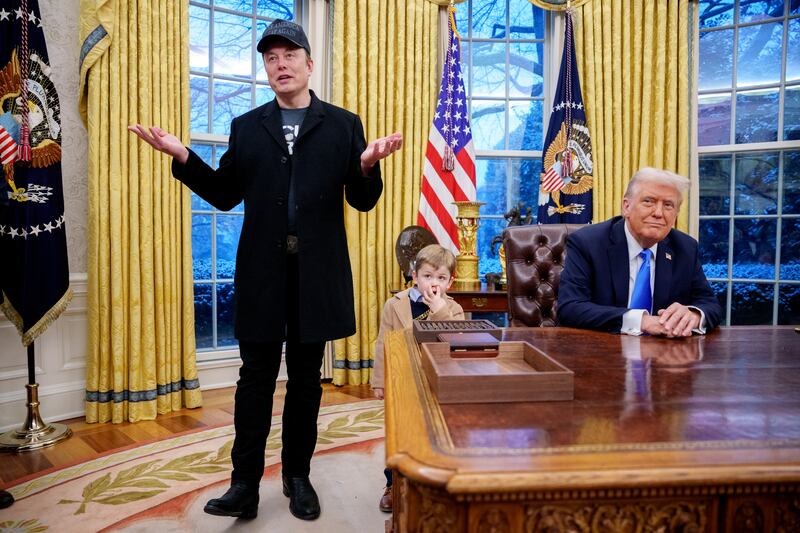 Tesla and SpaceX CEO Elon Musk, accompanied by U.S. President Donald Trump (R), and his son X Musk, speaks during an executive order signing in the Oval Office at the White House on February 11, 2025 in Washington, DC.