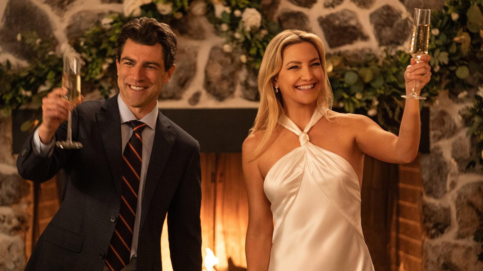 Max Greenfield as Lev Levinson and Kate Hudson as Isla Gordon