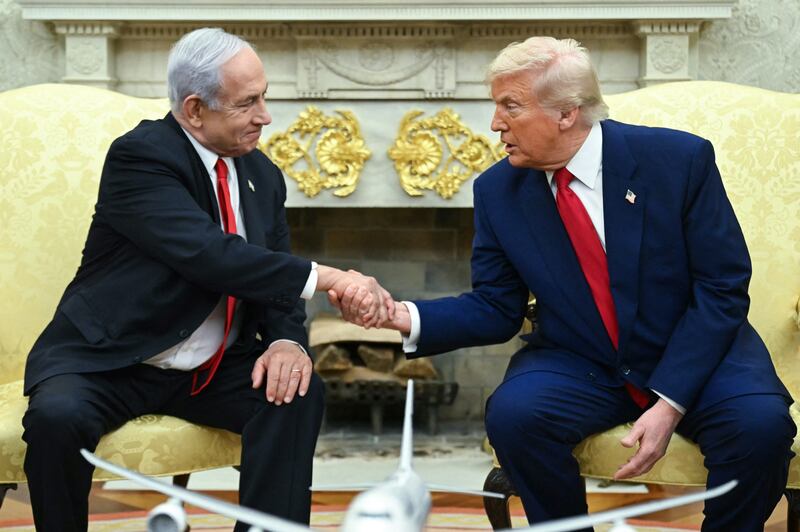 US President Donald Trump shakes hands with Israeli Prime Minister Benjamin Netanyahu during a meeting in the Oval Office of the White House in Washington, DC, on April 7, 2025. Israeli Prime Minister Benjamin Netanyahu was in Washington on Monday to meet Donald Trump, whom he will likely ask for a reprieve from US tariffs while seeking further backing on Iran and Gaza.