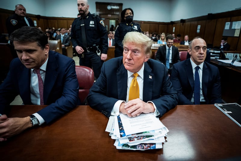 Former U.S. President Donald Trump, flanked by attorneys Todd Blanche and Emil Bove, arrives for his criminal trial at the Manhattan Criminal Court in New York, NY on Wednesday, May 29, 2024.
