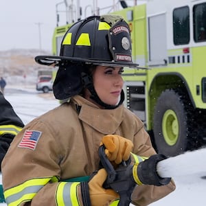 U.S. Department of Homeland Security Secretary Kristi Noem participates in a firefighting drill with a training helicopter during a tour of U.S. Coast Guard Air Station in Kodiak, Alaska, U.S., March 17, 2025.     Alex Brandon/Pool via REUTERS