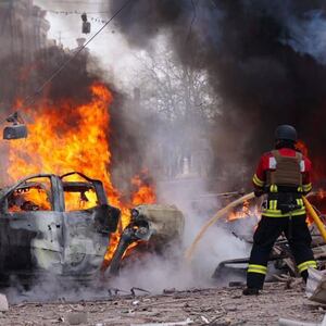 Firefighters continue to extinguish the cars fires following the Russian missile attack on Sumy, Ukraine on April 13, 2025