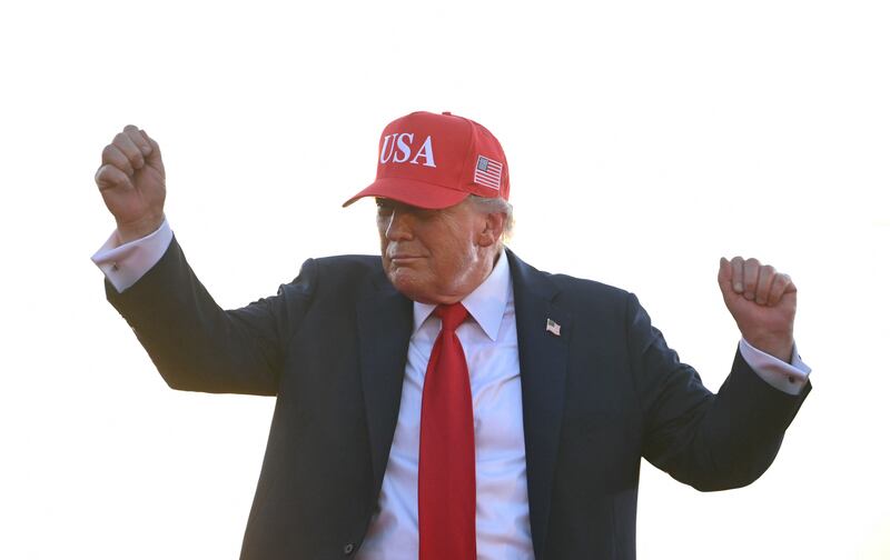 President Donald Trump dances as he leaves the stage after speaking at the Salute to America Celebration at the Iowa State Fairgrounds in Des Moines