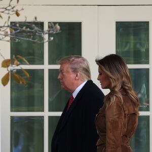 U.S. President Donald Trump and first lady Melania Trump walk back to the Oval Office after the pardoning of the 72nd National Thanksgiving Turkeys during ceremonies in the Rose Garden of the White House in Washington, U.S., November 26, 2019.