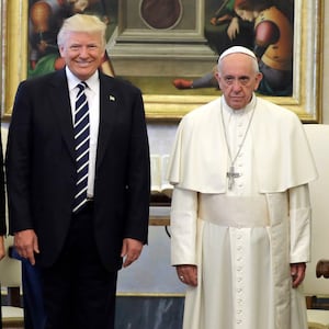 Pope Francis (R) poses with US President Donald Trump (L) at the end of a private audience at the Vatican on May 24, 2017.