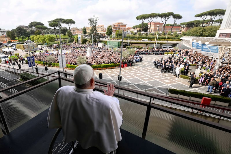 Pope Francis greets supporters from a balcony of the Gemelli Hospital on March 23, 2025 in Rome, Italy.