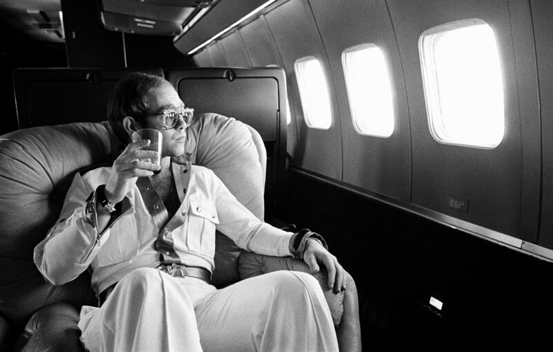 Elton flies on his private Boeing 720 airplane known as "The Starship" during his 1974 tour.