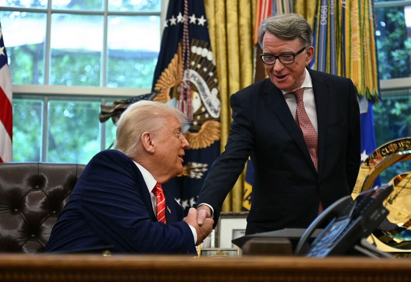 US President Donald Trump shakes hands with British ambassador to the United States Peter Mandelson after making a trade announcement in the Oval Office of the White House in Washington, DC, on May 8, 2025.