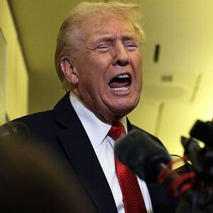 U.S. President Donald Trump speaks to members of the press on October 19, 2025 aboard Air Force One. The President is returning to Washington, DC, after spending his weekend at Mar-a-Lago resort in Palm Beach, Florida.
