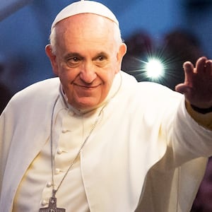 Pope Francis waves from the Popemobile on his way to attend the Via Crucis on Copacabana Beach during World Youth Day celebrations on July 26, 2013 in Rio de Janeiro, Brazil. More than 1.5 million pilgrims are expected to join the pontiff for his visit to the Catholic Church's World Youth Day celebrations which is running July 23-28.