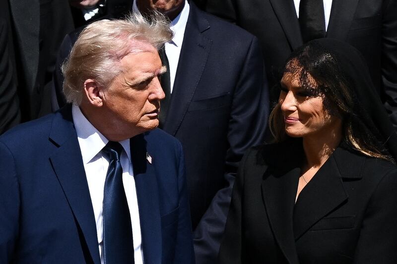 U.S President Donald Trump and first lady Melania Trump attend the funeral Mass of Pope Francis in St. Peter's Square at the Vatican, April 26, 2025. REUTERS/Dylan Martinez