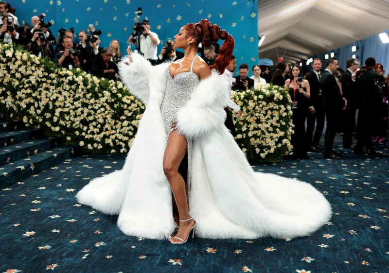 Megan Thee Stallion poses during the Met Gala, an annual fundraising gala held for the benefit of the Metropolitan Museum of Art's Costume Institute with this year's theme 'Superfine: Tailoring Black Style,' in New York City, New York, U.S., May 5, 2025.
