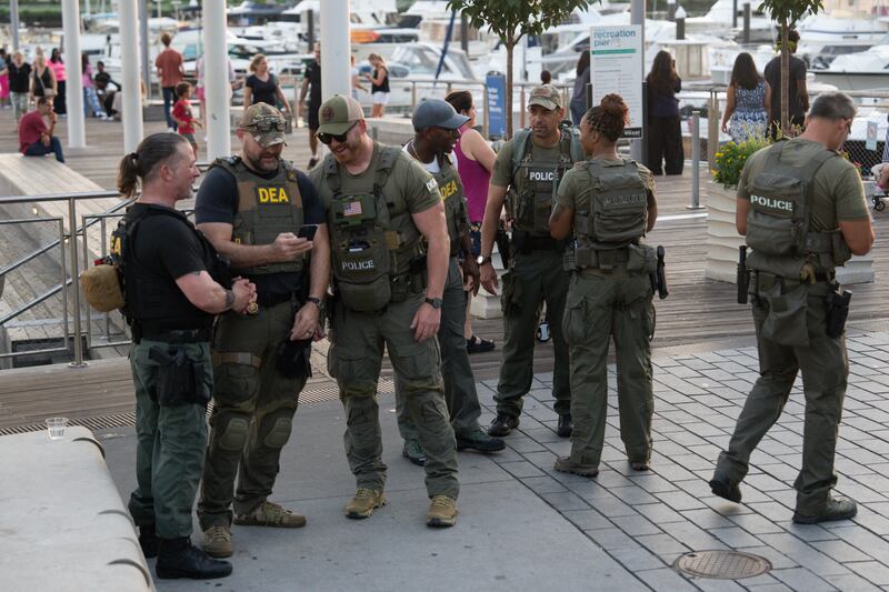 Drug Enforcement Agents walk along The Wharf on August 14, 2025 in Washington, DC.