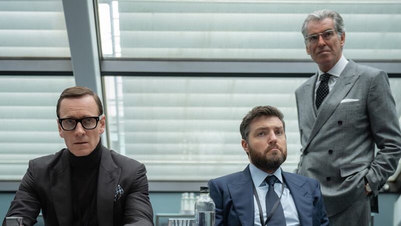 Michael Fassbender, Tom Burke, and Pierce Brosnan.