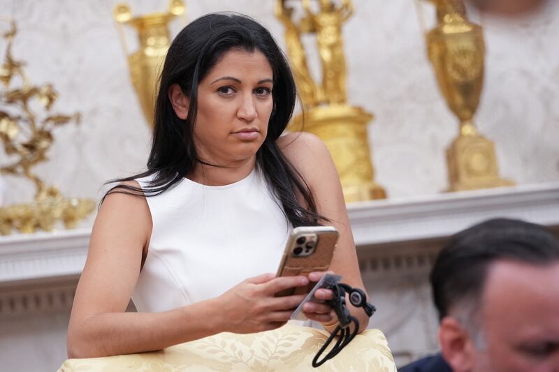 WASHINGTON, DC - MAY 30: White House Deputy Chief of Staff Stephen Miller's wife, Katie Miller, listens as U.S. President Donald Trump and Tesla CEO Elon Musk speak to reporters in the Oval Office of the White House on May 30, 2025 in Washington, DC. Musk, who served as an adviser to Trump and led the Department of Government Efficiency, announced he would leave his role in the Trump administration to refocus on his businesses.  (Photo by Kevin Dietsch/Getty Images)