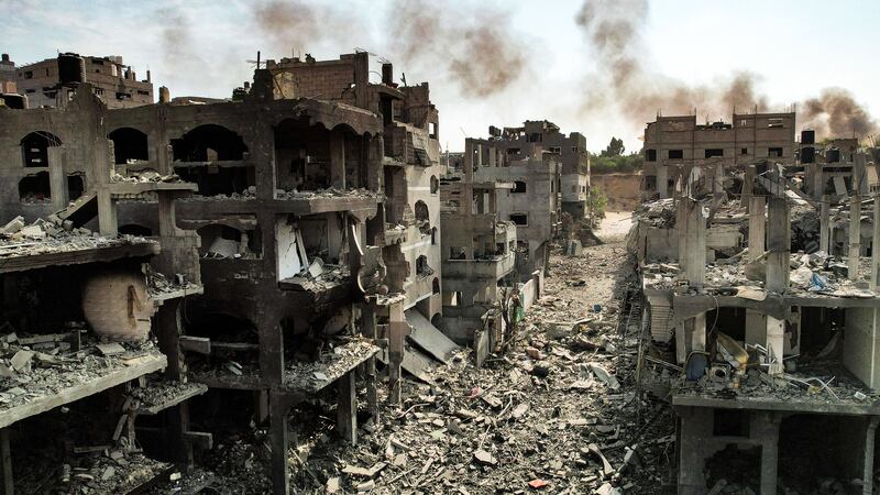 A photo including an aerial view of buildings destroyed by Israeli air strikes in the Jabalia camp for Palestinian refugees in Gaza City.
