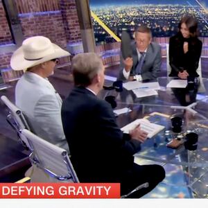 Richard Quest waves his shoe at Scott Jennings on CNN.