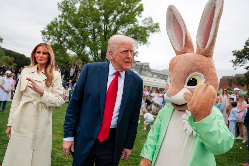 U.S. President Donald Trump, first lady Melania Trump and the Easter Bunny greet guests durning the White House Egg Roll on the South Lawn on April 21, 2025 in Washington, DC.