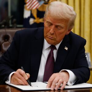 President Donald Trump signs executive orders in the Oval Office of the White House on January 20, 2025 in Washington, DC.