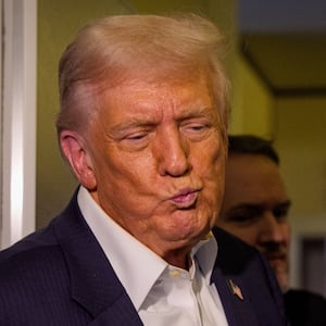 U.S. President Donald Trump, accompanied by U.S. Secretary of State Marco Rubio (R), takes a question from a reporter aboard Air Force One on October 27, 2025, in flight. Trump is in route to Japan after attending the Association of Southeast Asian Nations (ASEAN) summit in Malaysia, and will travel on to South Korea for the Asia-Pacific Economic Cooperation (APEC) forum. (Photo by Andrew Harnik/Getty Images)