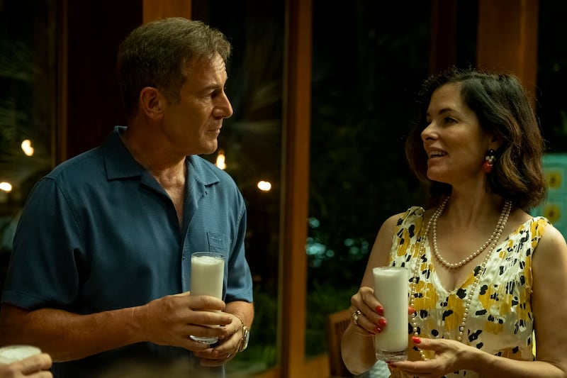 Jason Isaacs and Parker Posey