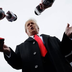 A photo of Donald Trump taking questions from journalists