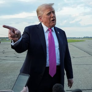 U.S. President Donald Trump speaks to the media before boarding Air Force One to depart for Washington, at Morristown Municipal Airport in Morristown, New Jersey, U.S., September 14, 2025. REUTERS/Ken Cedeno
