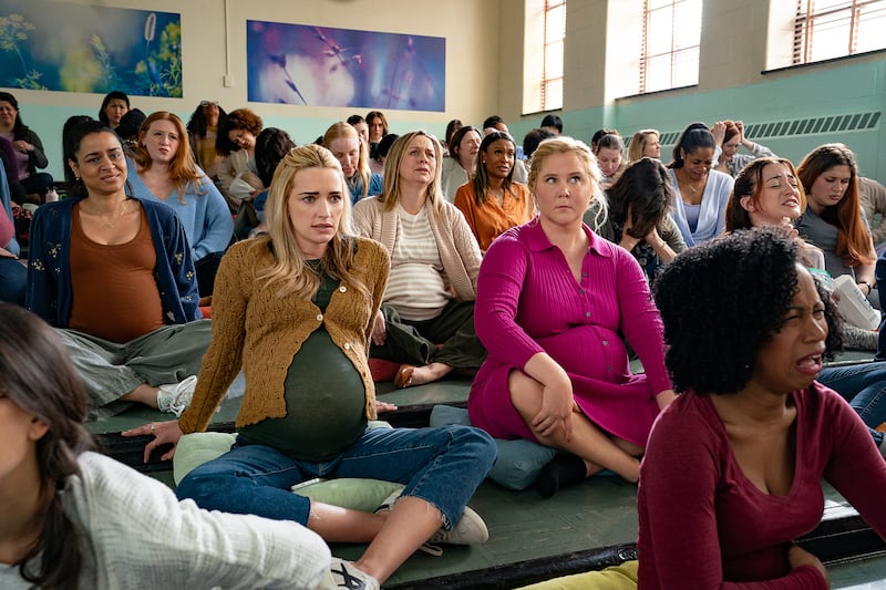 Brianne Howey and Amy Schumer.