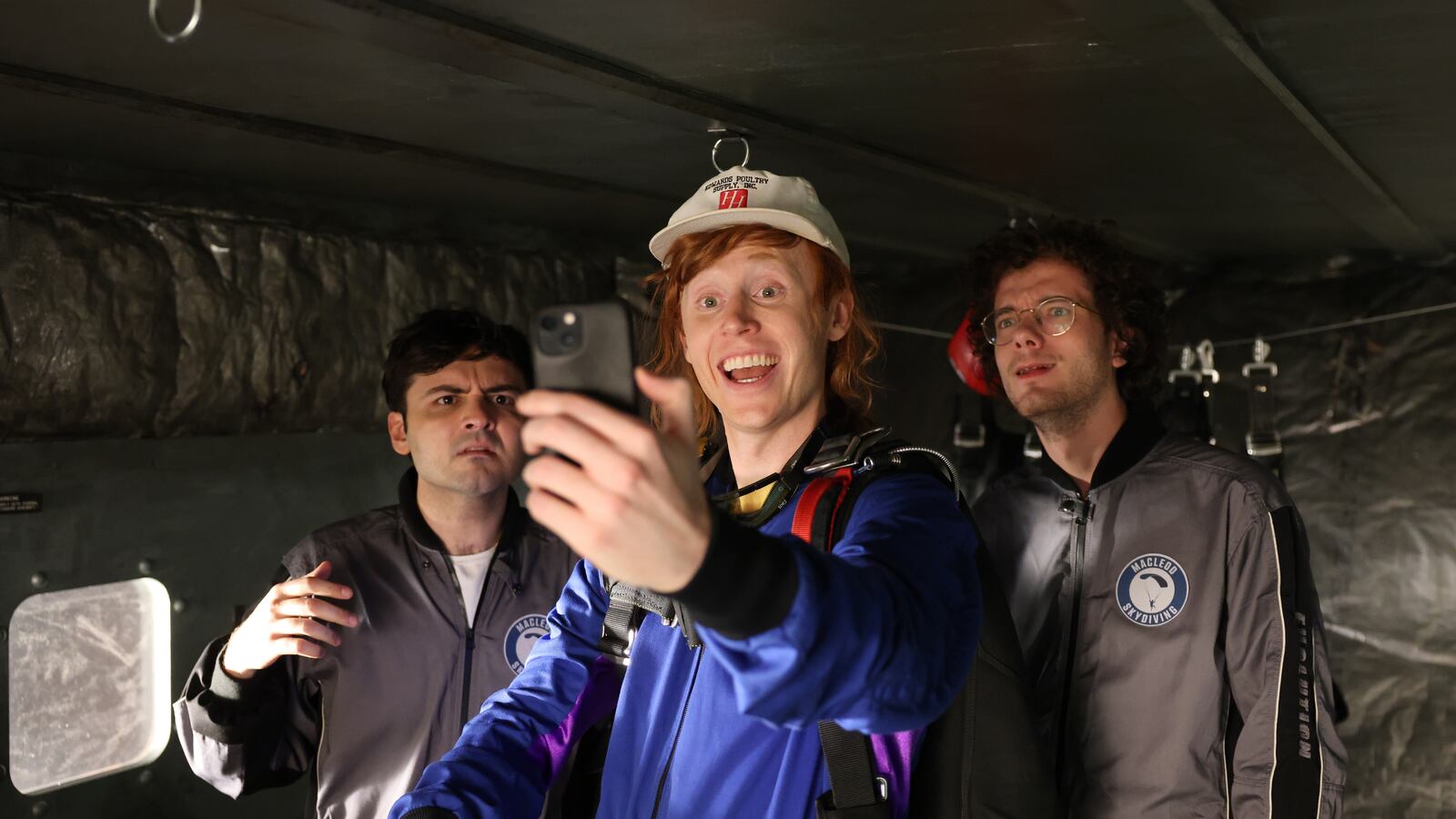 SATURDAY NIGHT LIVE -- Episode 1868 -- Pictured: (l-r) John Higgins, Ben Marshall, and Martin Herlihy during the "Skydiving" sketch on Saturday, October 19, 2024 -- (Photo by: Holland Rainwater/NBC via Getty Images)
