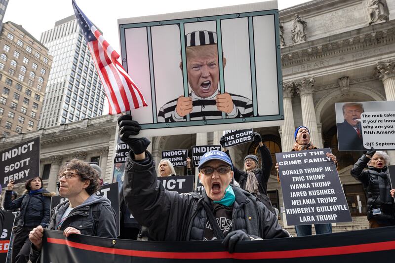 A photo including activists and allies at the New York Public Library calling for the Indictment of Donald Trump