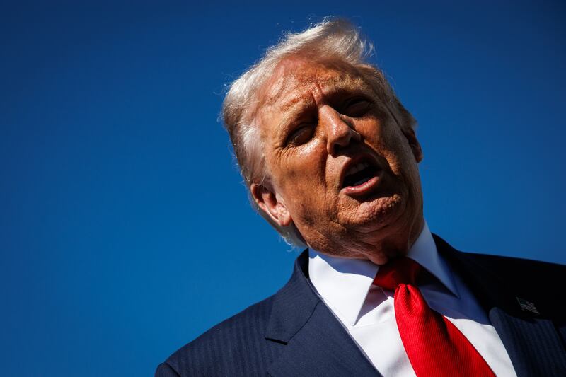 WEST PALM BEACH, FLORIDA - OCTOBER 31: US President Donald Trump speaks to reporters as he arrives at Palm Beach International Airport on October 31, 2025 in West Palm Beach, Florida. Trump is spending the weekend at his Mar-A-Lago estate in Palm Beach, Florida. (Photo by Samuel Corum/Getty Images)