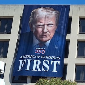 The Department of Labor building, displaying a banner of Donald Trump and Theodore Roosevelt.