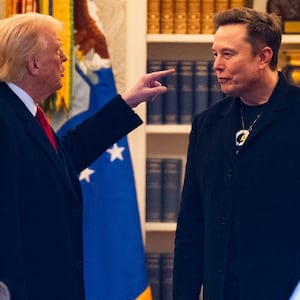 US President Donald Trump and Elon Musk (R).