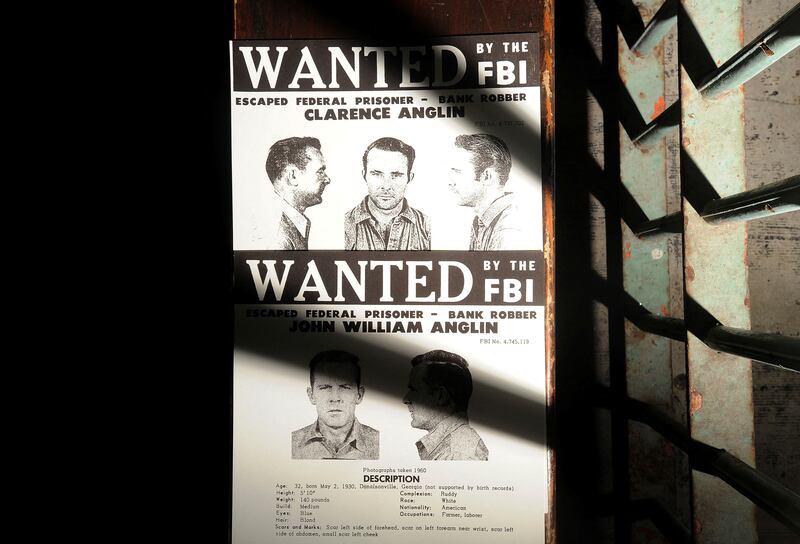 FILE PHOTO: A copy of John and Clarence Anglin's wanted poster rests outside a medical cell on Alcatraz Island on Monday, June 11, 2012, in the San Francisco Bay. The brothers, along with fellow inmate Frank Morris, escaped from the federal prison on June 11, 1962.  REUTERS/Noah Berger/File Photo