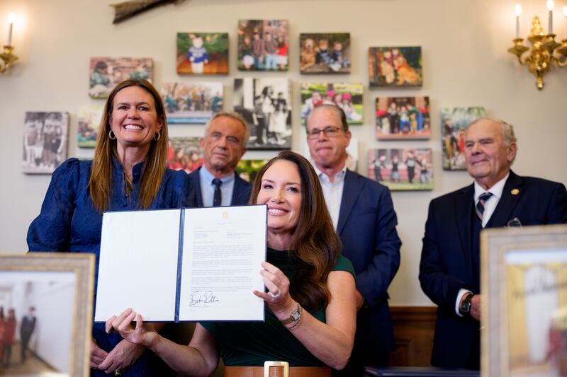 WASHINGTON, DC - JUNE 10: U.S. Agriculture Secretary Brooke Rollins (C), accompanied by (L-R) Arkansas Gov. Sarah Huckabee Sanders, Health and Human Services Secretary Robert F. Kennedy Jr., Indiana Gov. Mike Braun, and Rep. Jim Baird (R-IN), signs one of three new SNAP food choice waivers for the states of Idaho, Utah, and Arkansas in her office at the United States Department of Agriculture Whitten Building on June 10, 2025 in Washington, DC. The wavers will limit what the Supplemental Nutrition Assistance Program can select as eligible foods, targeting unhealthy food. (Photo by Andrew Harnik/Getty Images)