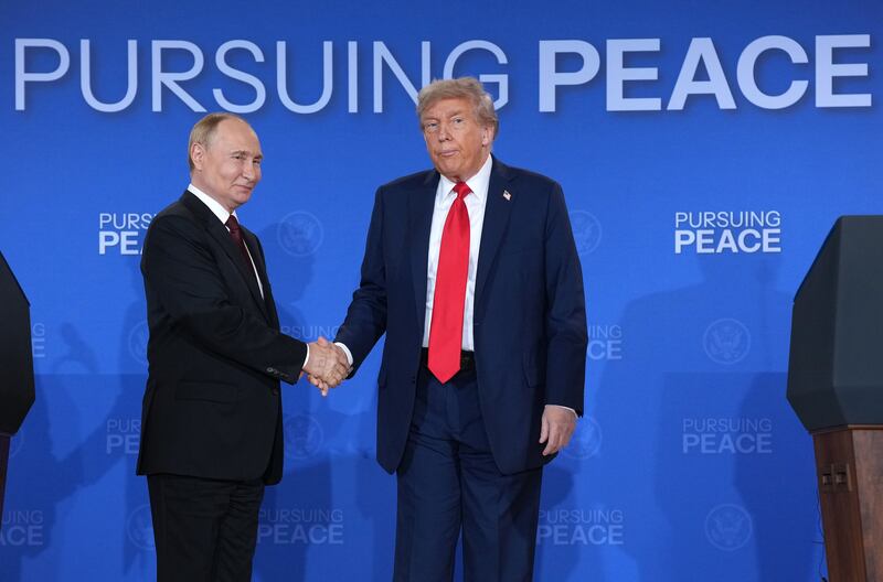 President Donald Trump and Russian President Vladimir Putin shake hands at the end of a press conference at Joint Base Elmendorf-Richardson on August 15, 2025 in Anchorage, Alaska where they did not take any questions and did not reveal anything had been achieved at their meeting besides a promise for more talks.