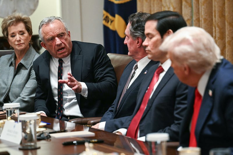 US Secretary of Health and Human Services Robert F. Kennedy Jr. (2L) speaks during a cabinet meeting hosted by US President Donald Trump (R) in the Cabinet Room of the White House in Washington, DC, on October 9, 2025. Trump said Thursday he would try to go to Egypt for the signing of a Gaza ceasefire and hostage release deal between Israel and Hamas. (Photo by Jim WATSON / AFP) (Photo by JIM WATSON/AFP via Getty Images)