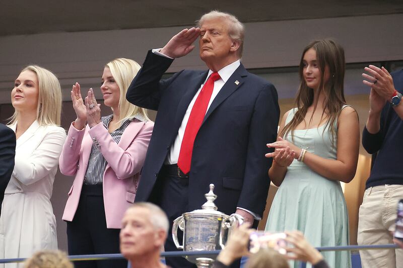 White House Press Secretary Karoline Leavitt, Attorney General Pam Bondi, U.S. President Donald Trump and granddaughter to Donald Trump Arabella Kushner stand for the national anthem.